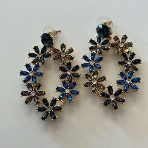 Pierced earrings. Blue and crystal rhinestones. Gold toned backing. 2 1/2”